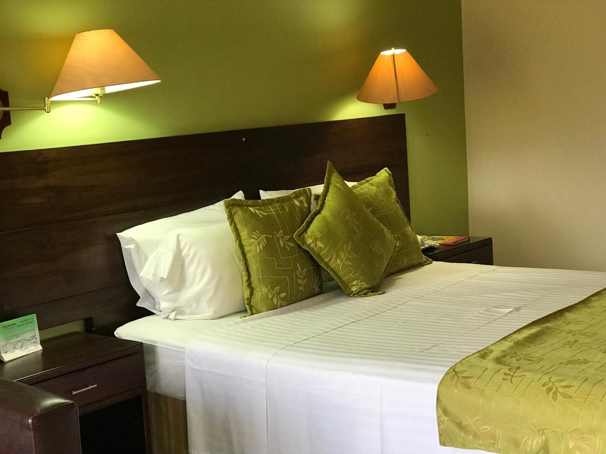 Casa Morales Hotel Internacional Y Centro De Convenciones Ibague Luaran gambar A bedroom at the hotel